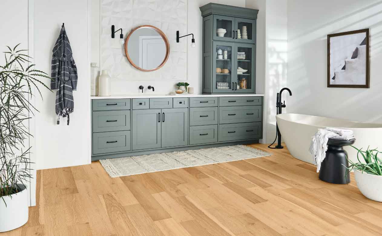 Wide plank engineered hardwood floor in bathroom 