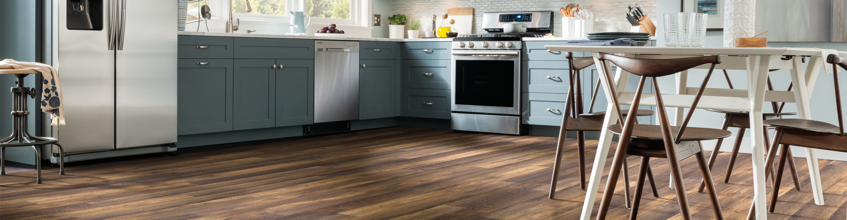 Vinyl plank floor with casual seating, kitchen stainless steel 